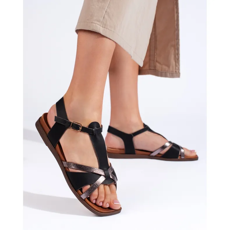 Black flat sandals by Sergio Leone