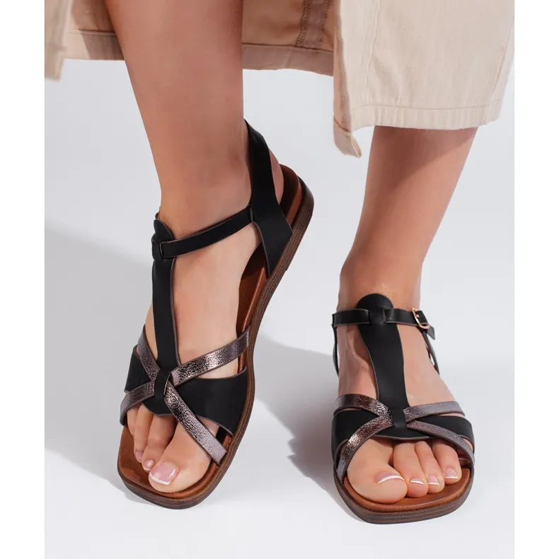 Black flat sandals by Sergio Leone