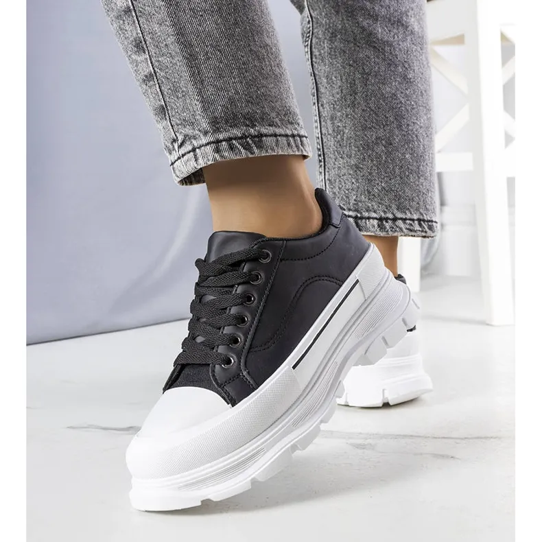 Black high platform sneakers from Kari