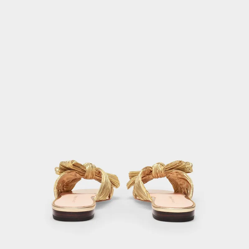 Daphne Knot Flat Sandals in Gold Fabric