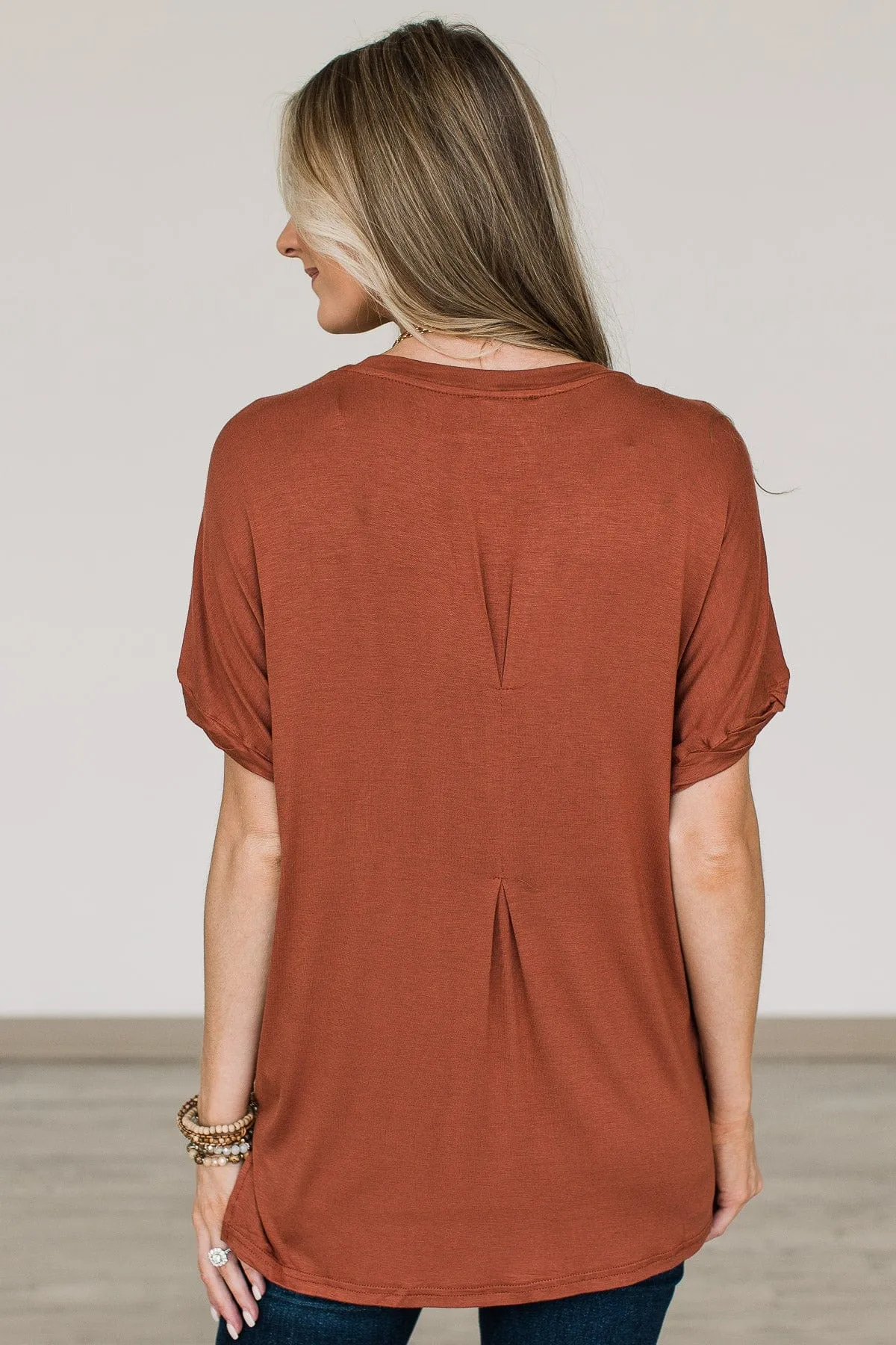 Rust Button Top with Eye-Catching Design.